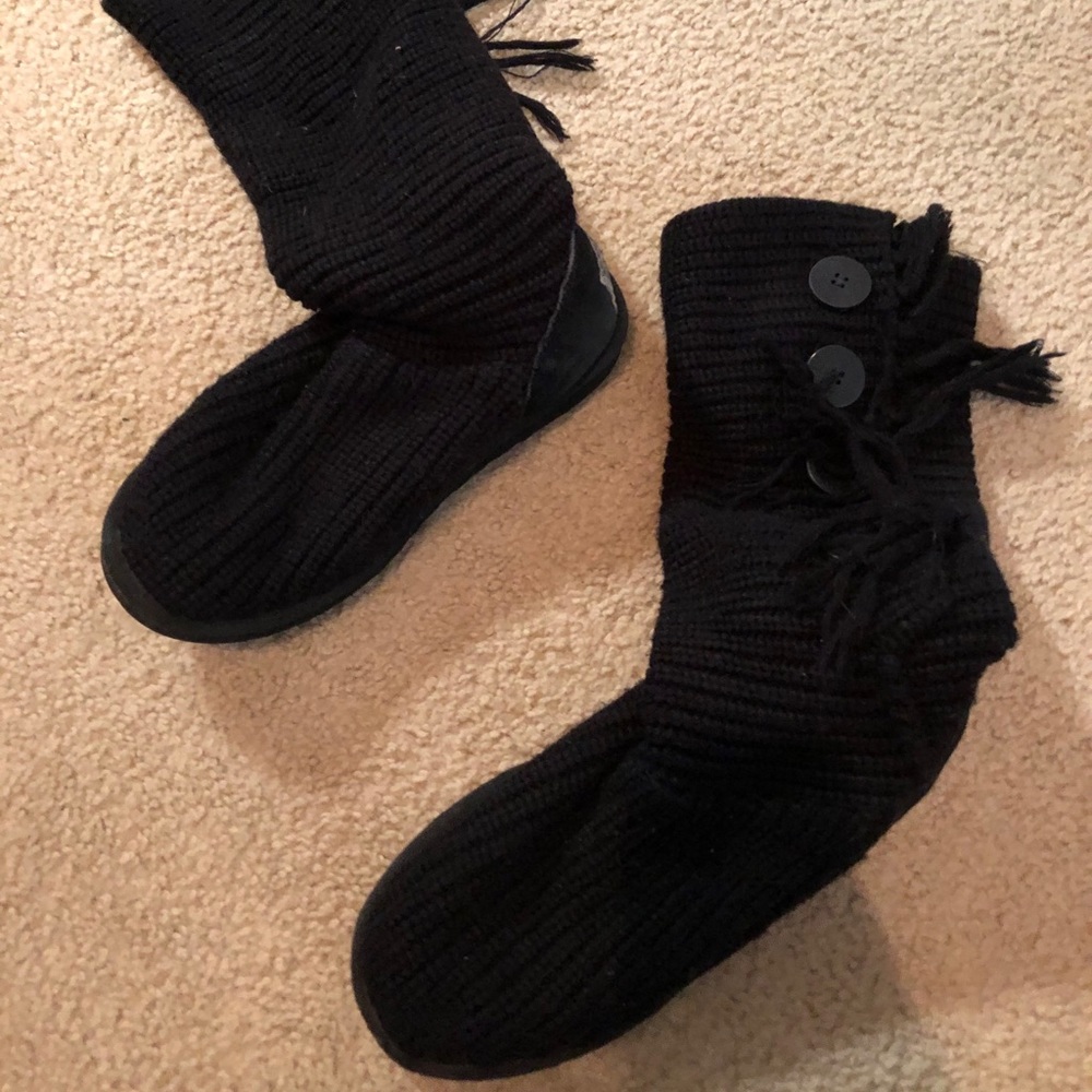 UGG boots with fringe and buttons.